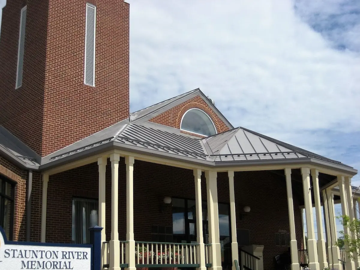 Skilled roofing craftsmen working on a residential roof in Hoffmansville